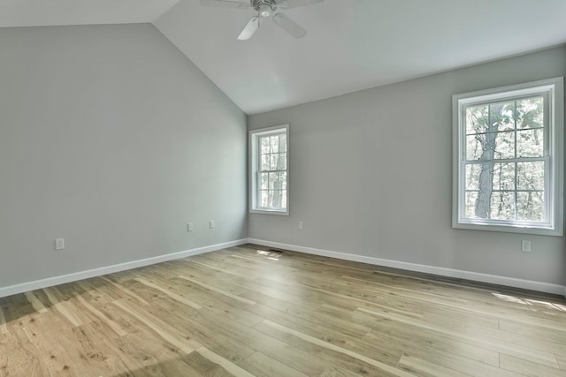 1465 Hooksett Rd Unit 403, Hooksett, NH 03106 - empty room with ceiling fan, vaulted ceiling, light wood-type flooring, and baseboards