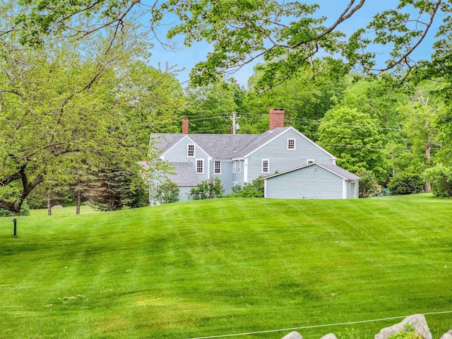 245-247 Danville Rd, Fremont, NH 03044 - view of front of house with a chimney and a front yard