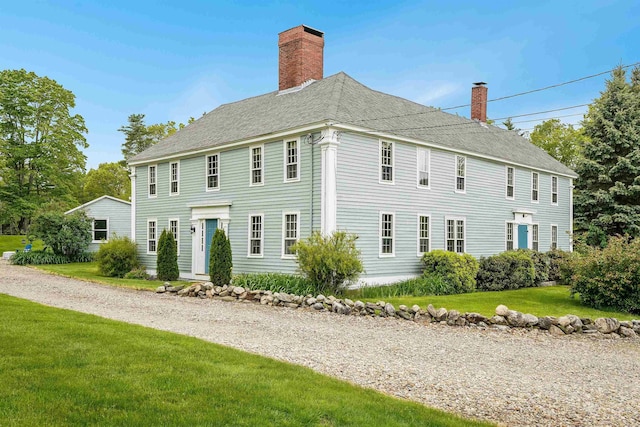 245-247 Danville Rd, Fremont, NH 03044 - colonial inspired home with a chimney, a front lawn, and a shingled roof