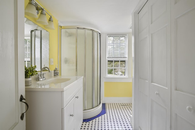 245-247 Danville Rd, Fremont, NH 03044 - full bathroom featuring a shower stall, vanity, baseboards, and a closet