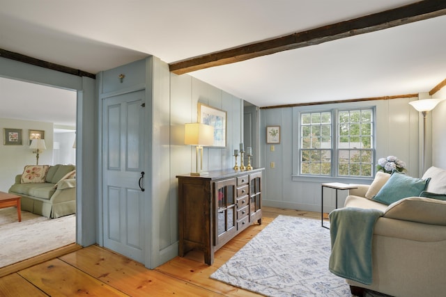 245-247 Danville Rd, Fremont, NH 03044 - living room featuring light wood finished floors and beam ceiling