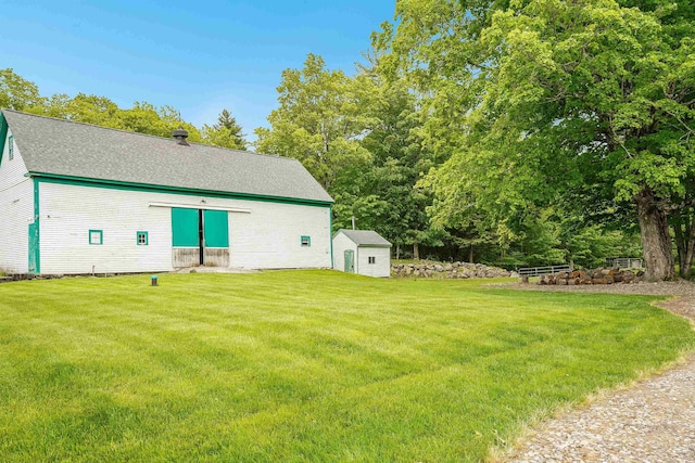 245-247 Danville Rd, Fremont, NH 03044 - rear view of house featuring a yard and roof with shingles