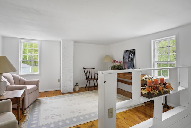 245-247 Danville Rd, Fremont, NH 03044 - bedroom featuring multiple windows, wood finished floors, and baseboards