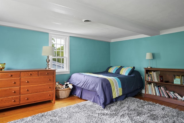 245-247 Danville Rd, Fremont, NH 03044 - bedroom with wood finished floors and beamed ceiling