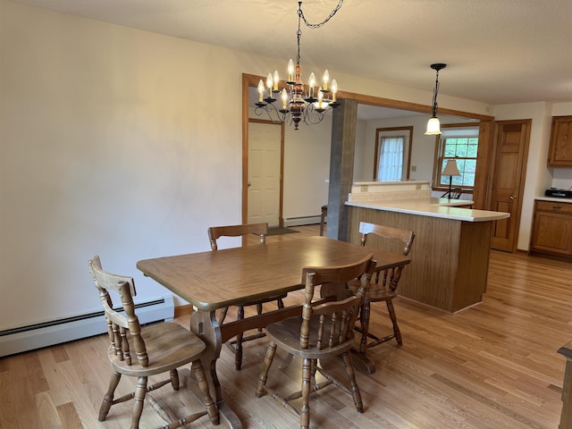 52 Jericho Rd, Grantham, NH 03753 - dining room with a baseboard radiator, light wood-type flooring, and a chandelier