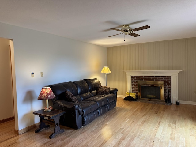 52 Jericho Rd, Grantham, NH 03753 - living room featuring a ceiling fan, wood finished floors, baseboards, and a brick fireplace