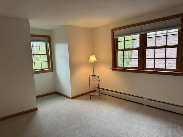 52 Jericho Rd, Grantham, NH 03753 - carpeted spare room featuring a baseboard heating unit and baseboards
