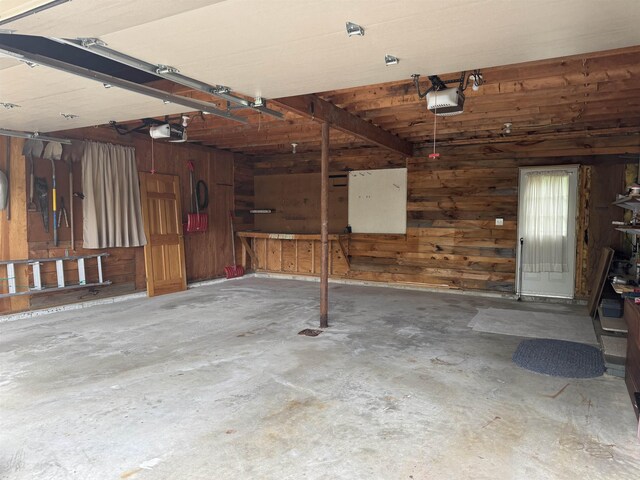 52 Jericho Rd, Grantham, NH 03753 - garage featuring wooden walls and a garage door opener