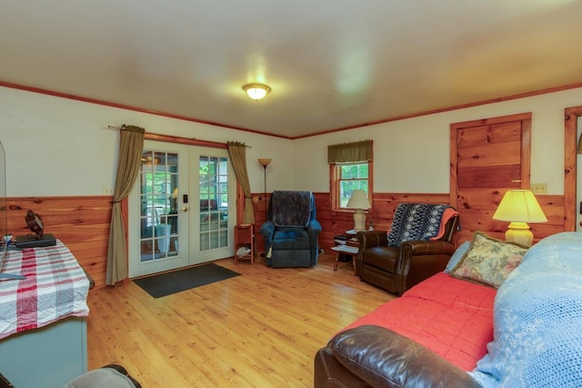 101 Mudgett Hill Rd, Loudon, NH 03307 - living area with french doors, wainscoting, wood finished floors, crown molding, and wood walls