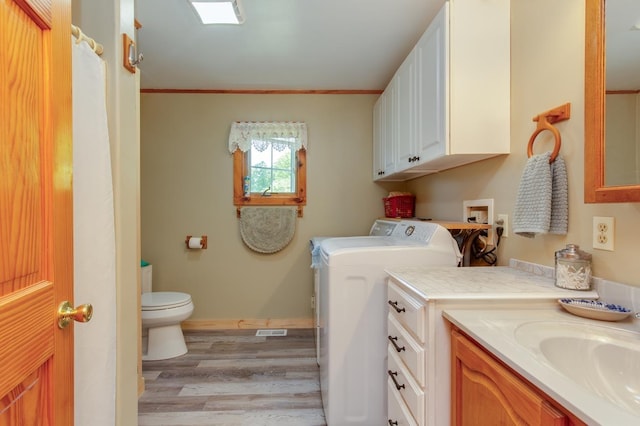 101 Mudgett Hill Rd, Loudon, NH 03307 - bathroom with toilet, separate washer and dryer, wood finished floors, vanity, and baseboards