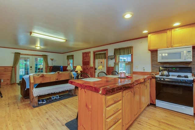 101 Mudgett Hill Rd, Loudon, NH 03307 - kitchen featuring white appliances, a peninsula, a wainscoted wall, light wood-style flooring, and ornamental molding