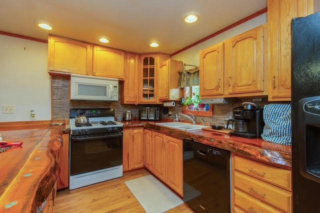 101 Mudgett Hill Rd, Loudon, NH 03307 - kitchen with gas range oven, black dishwasher, white microwave, a sink, and tasteful backsplash