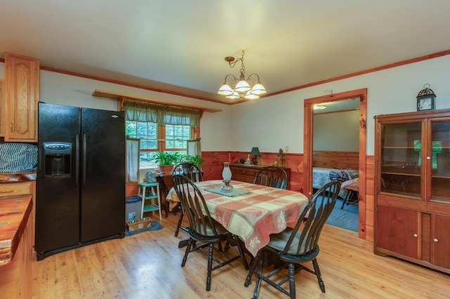 101 Mudgett Hill Rd, Loudon, NH 03307 - dining space with wainscoting, light wood-style flooring, crown molding, and a chandelier