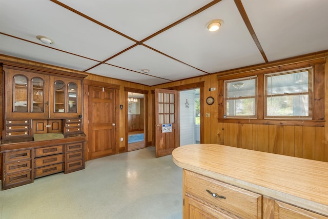 729 Suncook Valley Hwy, Epsom, NH 03234 - kitchen with wood walls, plenty of natural light, glass insert cabinets, and brown cabinets