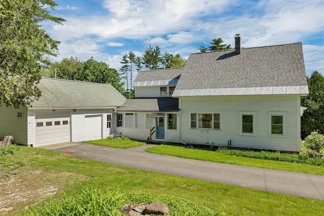 729 Suncook Valley Hwy, Epsom, NH 03234 - view of front of property featuring an attached garage, driveway, a shingled roof, a chimney, and a front yard