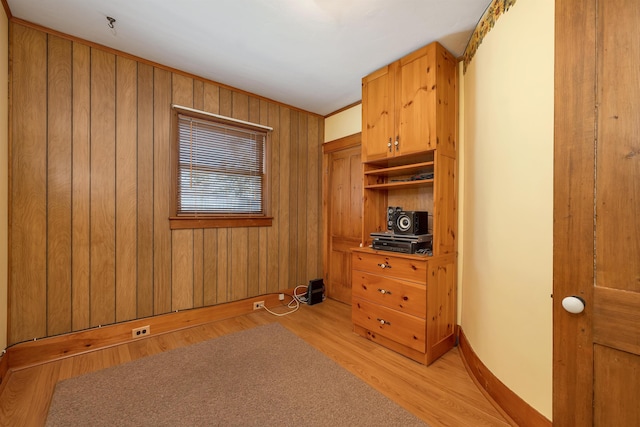 729 Suncook Valley Hwy, Epsom, NH 03234 - unfurnished bedroom with light wood finished floors, baseboards, and wood walls