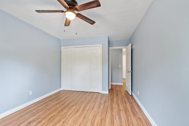 310 Brook Village Rd Unit 26, Nashua, NH 03062 - unfurnished bedroom with light wood-type flooring, baseboards, a closet, and ceiling fan
