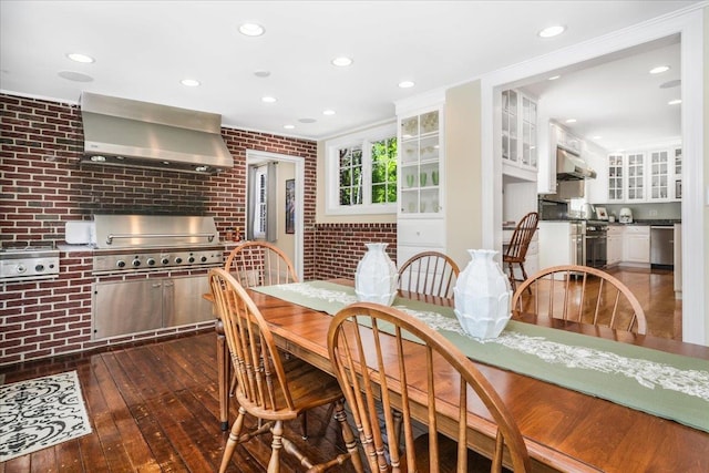 373 Whitford St, Manchester, NH 03104 - dining area with brick wall, dark wood-style floors, and recessed lighting