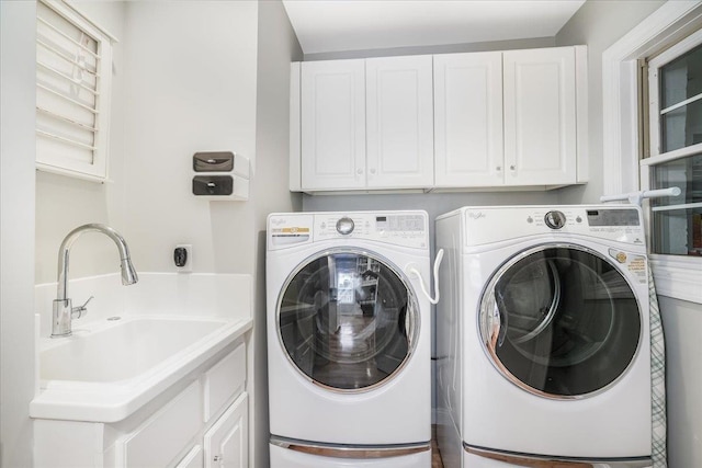 373 Whitford St, Manchester, NH 03104 - washroom with washing machine and dryer and cabinet space
