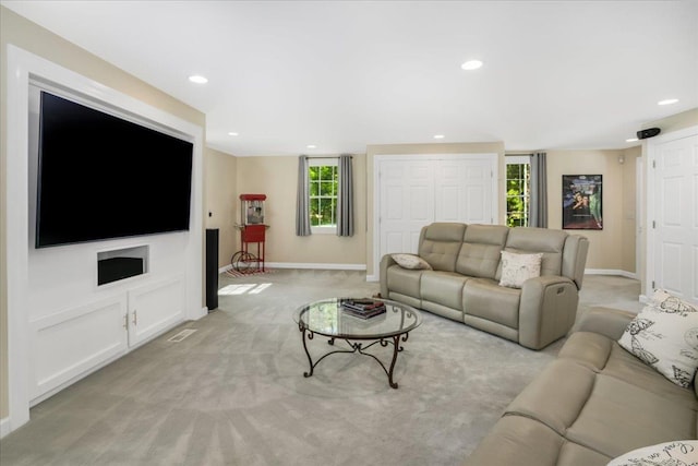 373 Whitford St, Manchester, NH 03104 - living area with baseboards, light colored carpet, and recessed lighting