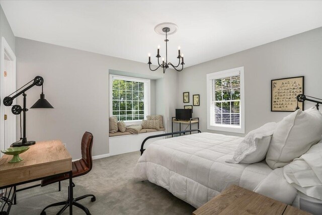 373 Whitford St, Manchester, NH 03104 - carpeted bedroom featuring a chandelier and baseboards