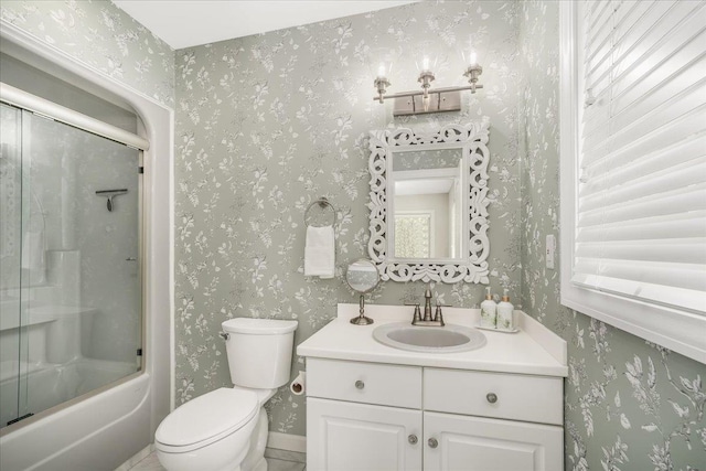 373 Whitford St, Manchester, NH 03104 - full bath with vanity, toilet, and combined bath / shower with glass door