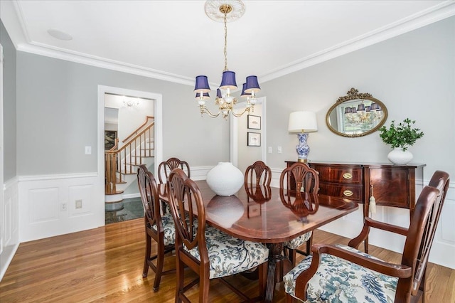 373 Whitford St, Manchester, NH 03104 - dining area with a chandelier, stairs, ornamental molding, and wood finished floors