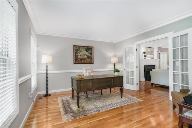 373 Whitford St, Manchester, NH 03104 - office area featuring ornamental molding, wood finished floors, a fireplace, baseboards, and french doors