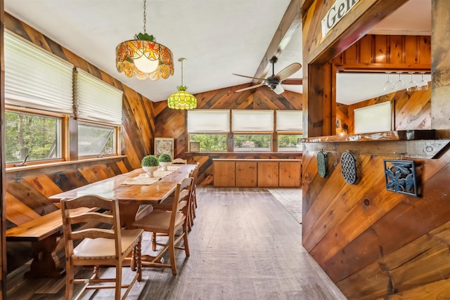 3-5 Cross St, Windham, NH 03087 - dining room featuring healthy amount of natural light, light wood-type flooring, wood walls, and ceiling fan