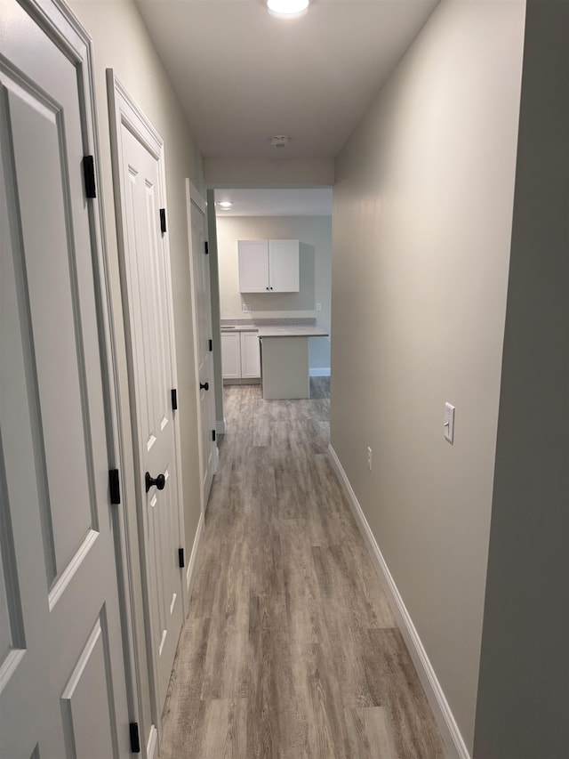 7 Willys Ln Unit 103, Milton, VT 05468 - hall with light wood-style flooring and baseboards