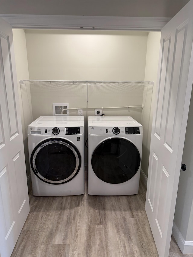 7 Willys Ln Unit 103, Milton, VT 05468 - laundry room with separate washer and dryer and wood finished floors