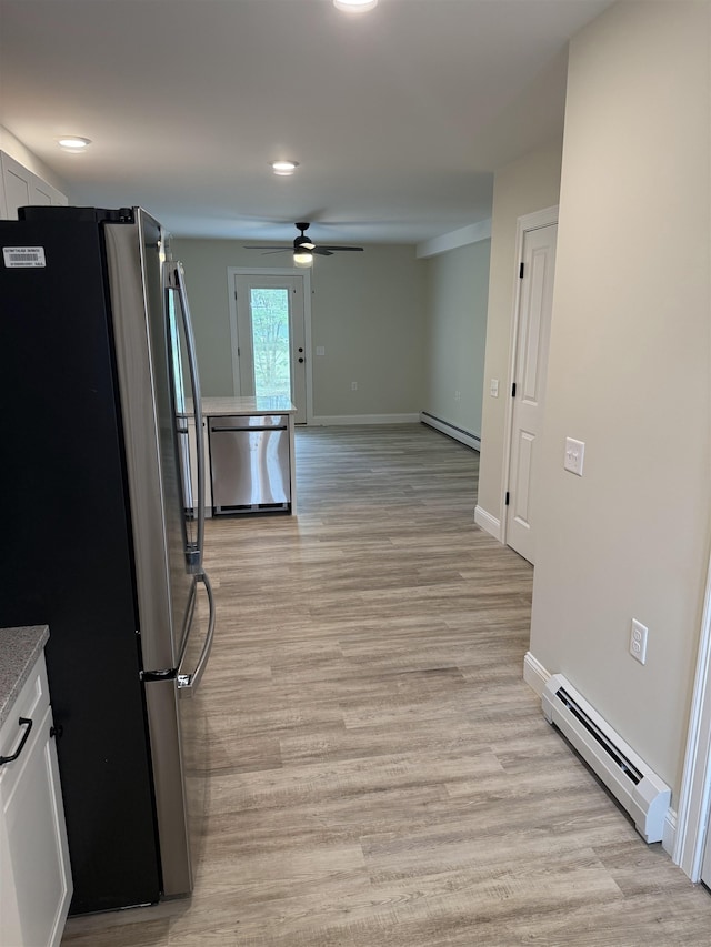7 Willys Ln Unit 103, Milton, VT 05468 - kitchen with stainless steel appliances, baseboard heating, a ceiling fan, light wood-style flooring, and recessed lighting