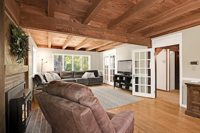 23 Cedarview Ln, Hampton, NH 03842 - living area featuring wooden ceiling with exposed beams, a brick fireplace, and wood finished floors