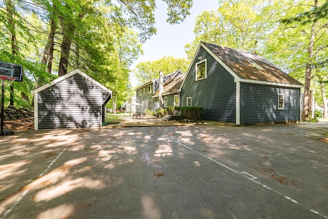 23 Cedarview Ln, Hampton, NH 03842 - view of side of home featuring asphalt driveway