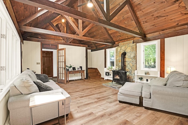 23 Cedarview Ln, Hampton, NH 03842 - living area featuring a wood stove, wooden ceiling with exposed beams, light wood-style flooring, and high vaulted ceiling