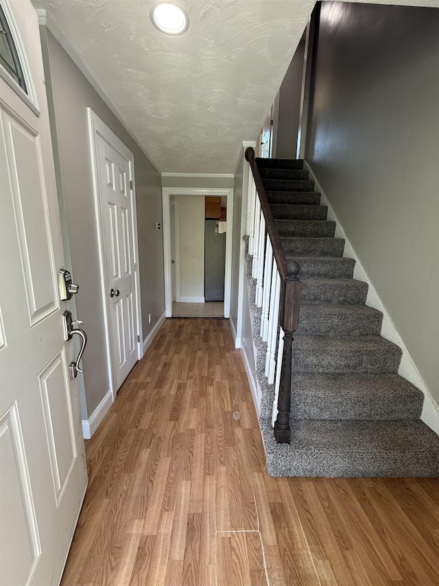 2 Germantown Rd, Derry, NH 03038 - entrance foyer with stairs, light wood-style flooring, and baseboards
