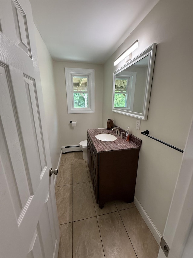 2 Germantown Rd, Derry, NH 03038 - bathroom with vanity, toilet, a baseboard radiator, tile patterned flooring, and baseboards