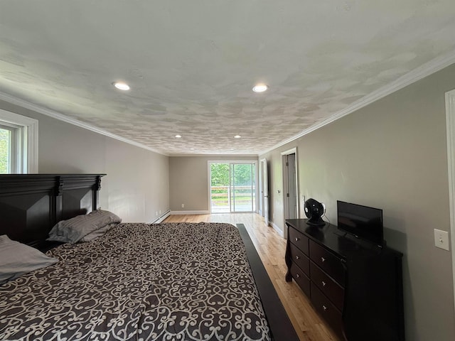 2 Germantown Rd, Derry, NH 03038 - bedroom with multiple windows, wood finished floors, recessed lighting, baseboards, and a baseboard heating unit