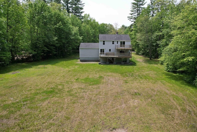 2 Germantown Rd, Derry, NH 03038 - view of green lawn featuring a deck and a view of trees