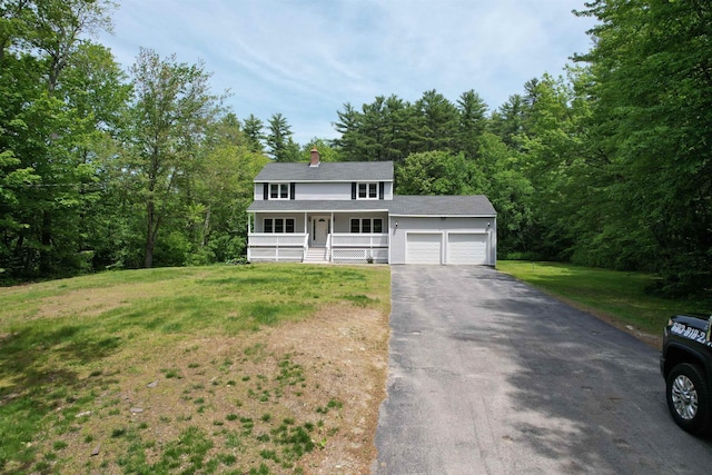2 Germantown Rd, Derry, NH 03038 - view of front of home with covered porch, a garage, a front yard, asphalt driveway, and a chimney