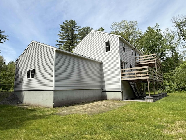 2 Germantown Rd, Derry, NH 03038 - view of home's exterior with a deck, a yard, and stairs