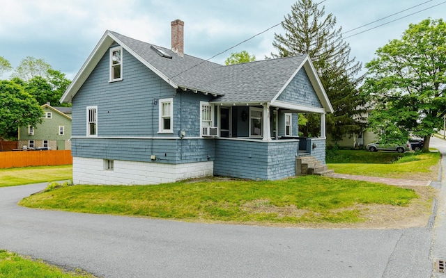 117 Gilsum St, Keene, NH 03431 - view of side of home with roof with shingles, covered porch, a chimney, and cooling unit