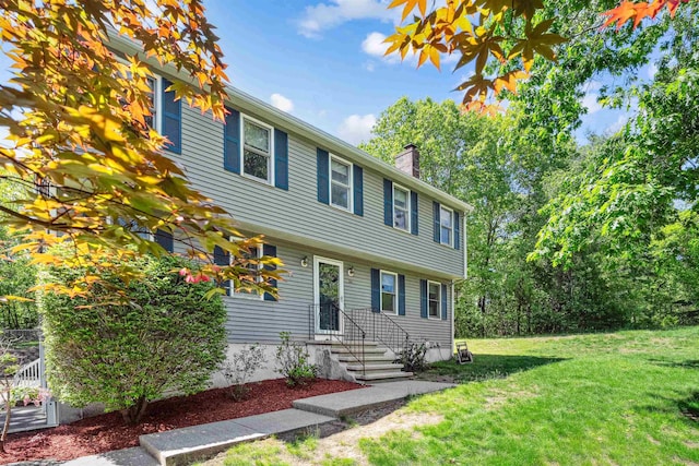 24 Theresa Ave, Salem, NH 03079 - colonial-style house with a chimney and a front lawn