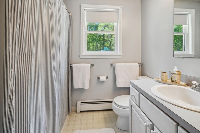 24 Theresa Ave, Salem, NH 03079 - bathroom with baseboard heating, plenty of natural light, vanity, and toilet