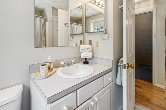 24 Theresa Ave, Salem, NH 03079 - full bathroom with vanity, toilet, and wood finished floors