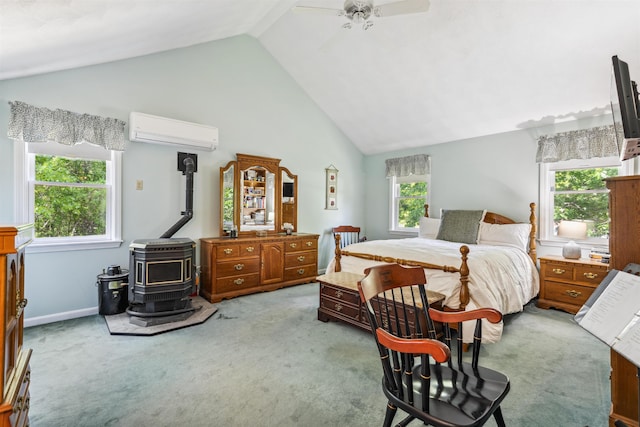 24 Theresa Ave, Salem, NH 03079 - bedroom with a wall mounted AC, a wood stove, carpet, a ceiling fan, and high vaulted ceiling