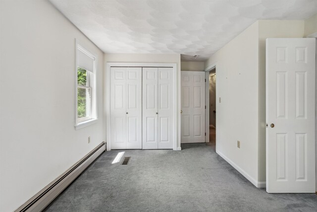 24 Theresa Ave, Salem, NH 03079 - unfurnished bedroom featuring baseboard heating, carpet floors, a closet, and baseboards