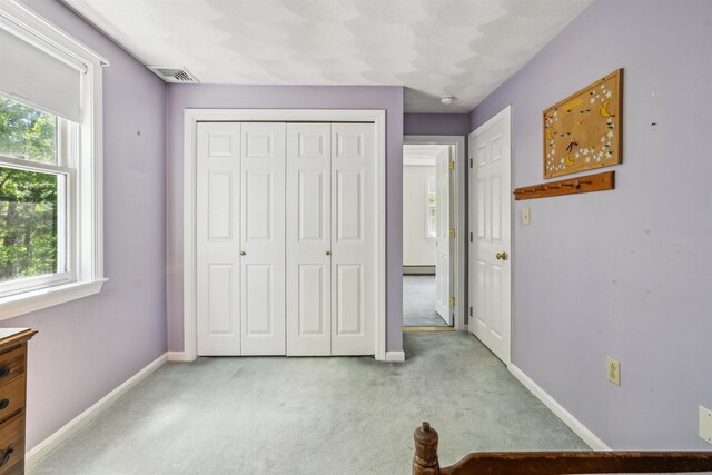 24 Theresa Ave, Salem, NH 03079 - unfurnished bedroom with light carpet, baseboards, and a closet