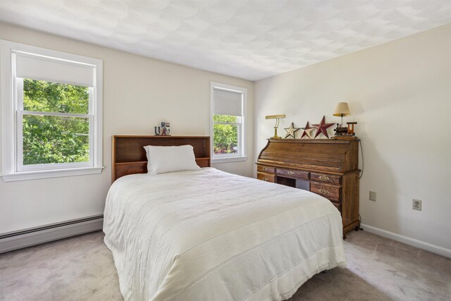 24 Theresa Ave, Salem, NH 03079 - carpeted bedroom with a baseboard heating unit and baseboards