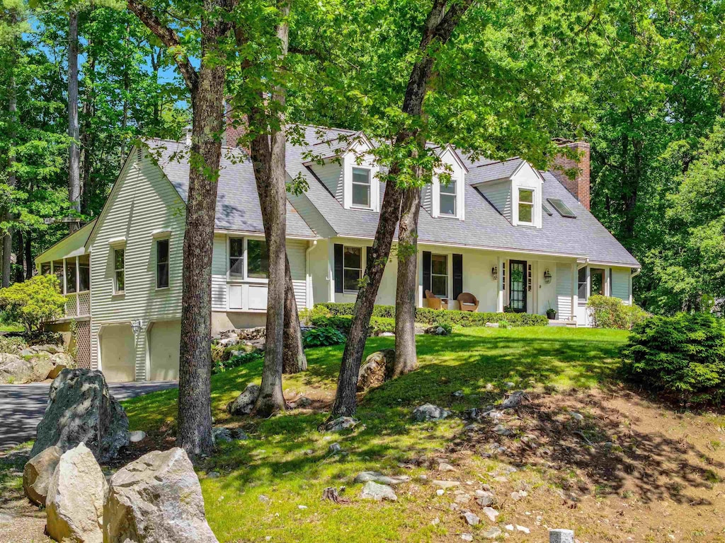 12 Hemlock Hill Rd, Amherst, NH 03031 - cape cod home with a chimney, an attached garage, roof with shingles, and a front yard